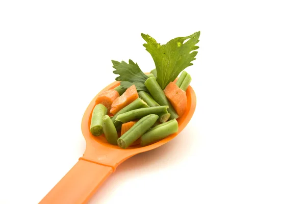 Soup Vegetables on Orange Spoon — Stock Photo, Image