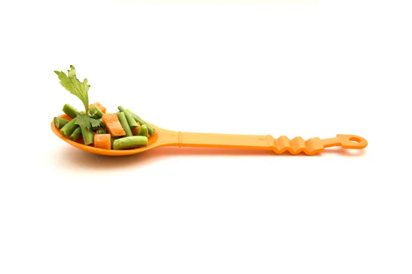 Soup Vegetables on Orange Spoon — Stock Photo, Image