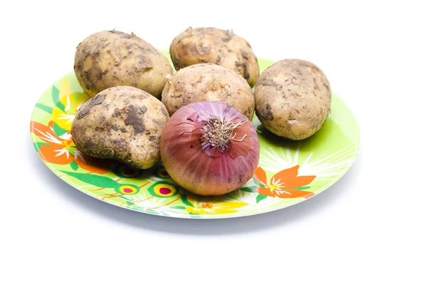 Patatas con Cebolla Roja en Placa Plástica —  Fotos de Stock