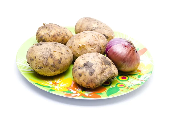 Patatas con Cebolla Roja en Placa Plástica —  Fotos de Stock