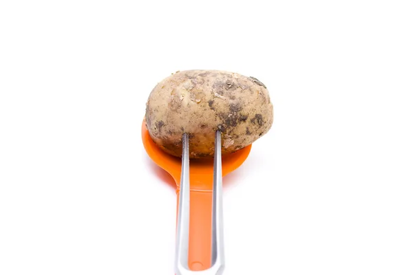 Patatas marrones pinchadas con tenedor de carne —  Fotos de Stock
