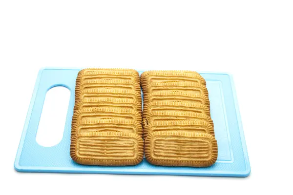 Biscotti appena sfornati su piatto blu — Foto Stock