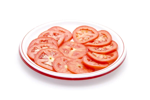 Geschnittene Tomaten auf Teller — Stockfoto