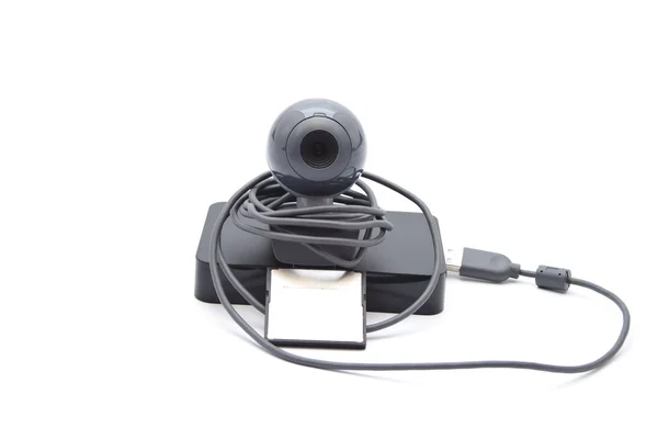 Webcam con disco duro externo y medio de tarjeta sobre fondo blanco —  Fotos de Stock