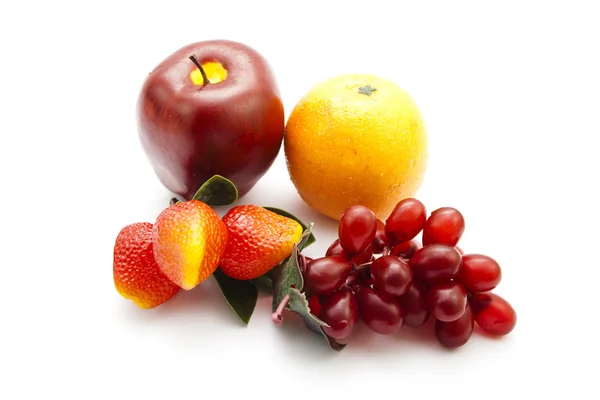 Frutas de plástico para la decoración sobre fondo blanco —  Fotos de Stock