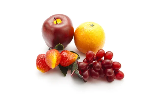 Frutas de plástico para la decoración sobre fondo blanco —  Fotos de Stock