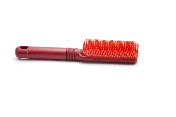 Escova de cabelo de plástico no fundo branco — Fotografia de Stock