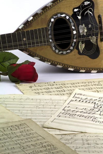 Old music sheets with mandolin Stock Image