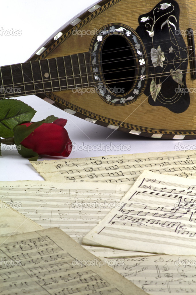 Old music sheets with mandolin