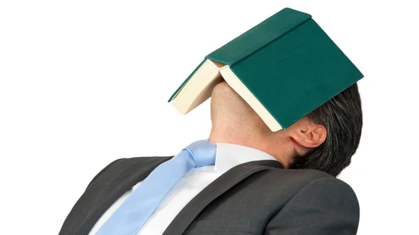 Affärsman sover efter att ha läst en bok. — Stockfoto