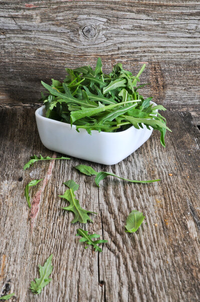 Bowl of fresh green, natural arugula