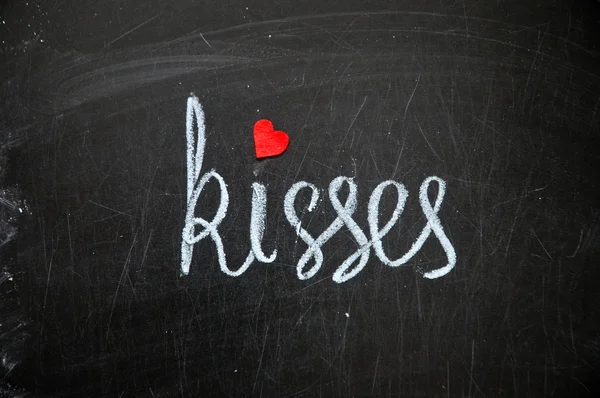 Happy valentines day, inscription on a board Kisses — Stock Photo, Image