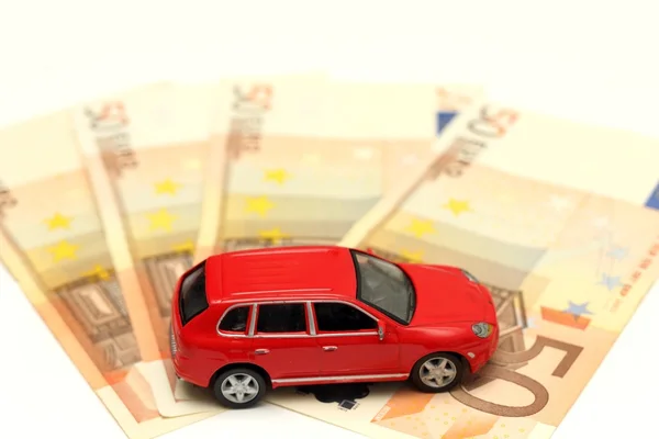 Geld en auto — Stockfoto