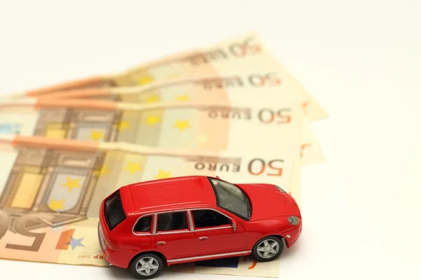 Geld en auto — Stockfoto