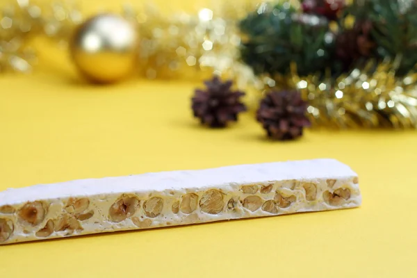 Nougat and Christmas decorations — Stock Photo, Image