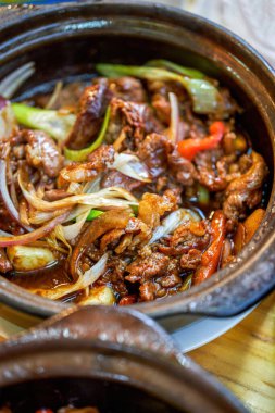 A pot of delicious and authentic traditional Cantonese cuisine in a hot pot, fat beef in a hot pot