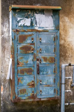 Old green metal mailbox cabinet