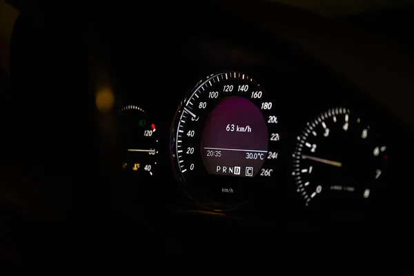 Close-up of dashboard lights of a car at night