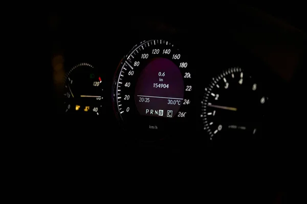 Close-up of dashboard lights of a car at night