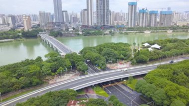 Yongjiang Bridge and riverside road traffic flow in Nanning, Guangxi, China