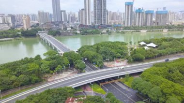 Yongjiang Bridge and riverside road traffic flow in Nanning, Guangxi, China