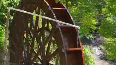 Close-up of wooden waterwheel in rural irrigation system