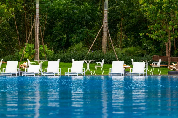 Infinity pool and lounge chairs in a luxury hotel