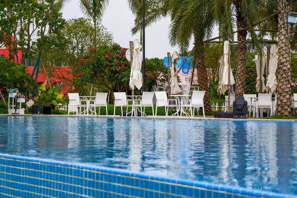 Infinity pool and lounge chairs in a luxury hotel