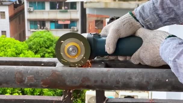 Worker Using Cutting Machine Cut Iron Guardrail Escalate Slow Motion — Vídeo de stock
