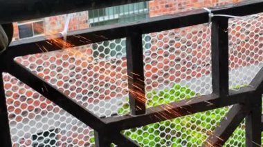 Elevated slow motion of cutting machine cutting jetted iron filings sparks