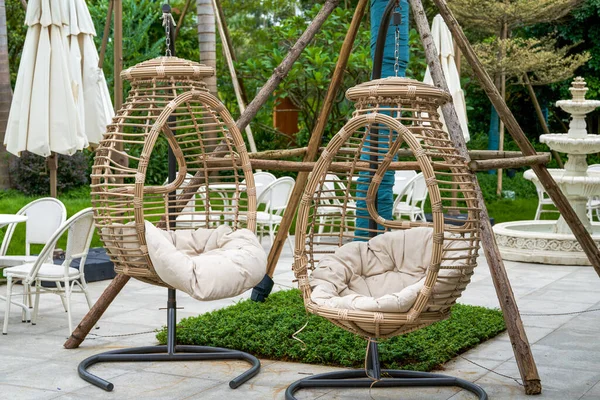 Closeup of leisure rattan hanging chair outdoors