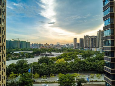 City building complex buildings and highway landscape in evening sunset