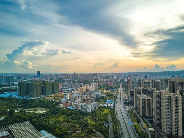 City building complex buildings and highway landscape in evening sunset