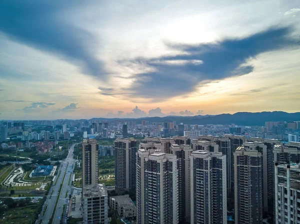 City building complex buildings and highway landscape in evening sunset