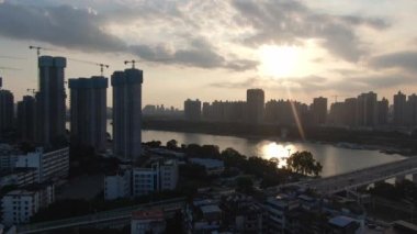 Aerial photography of Yongjiang Bridge and bustling buildings along the coast in Nanning, Guangxi, China