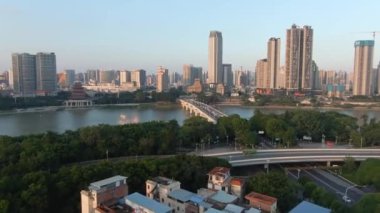 Aerial photography of Yongjiang Bridge and bustling buildings along the coast in Nanning, Guangxi, China