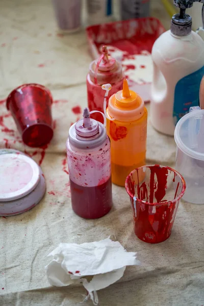 Watercolor painter's workbench and messy color paints
