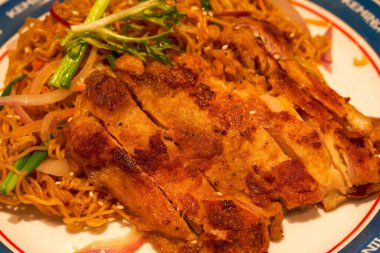A delicious Hong Kong-style tea restaurant dish, Fried Chicken Chop Chow Mein