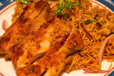 A delicious Hong Kong-style tea restaurant dish, Fried Chicken Chop Chow Mein