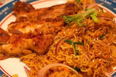 A delicious Hong Kong-style tea restaurant dish, Fried Chicken Chop Chow Mein