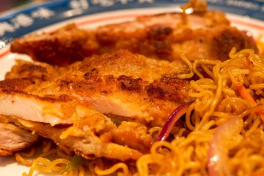 A delicious Hong Kong-style tea restaurant dish, Fried Chicken Chop Chow Mein