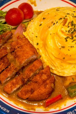 A delicious Hong Kong-style tea restaurant dish, curry pork chop omelette