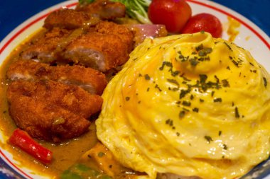 A delicious Hong Kong-style tea restaurant dish, curry pork chop omelette
