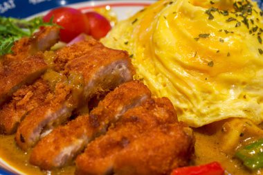 A delicious Hong Kong-style tea restaurant dish, curry pork chop omelette