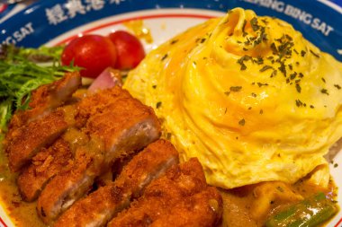 A delicious Hong Kong-style tea restaurant dish, curry pork chop omelette