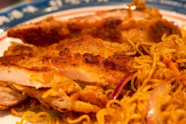 A delicious Hong Kong-style tea restaurant dish, Fried Chicken Chop Chow Mein