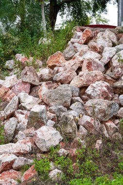 Large piles of rubble produced by blasting mountains in the wild