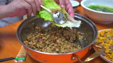 Cantonese traditional custom dish, Baosheng, fried rice wrapped with lettuce