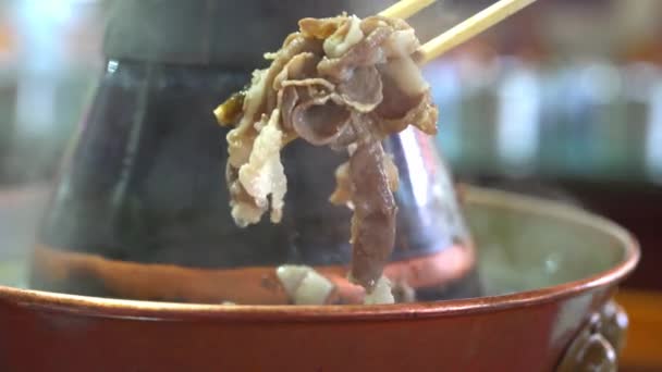 Two People Eating Old Beijing Hot Pot Mutton Copper Pot — Stockvideo