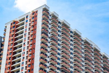 Close up of regular and neat balcony windows on a residential building in the city